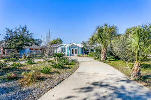 Unique Centrally located Pool home on corner lot is a short walk to Santa Rosa Sound public access area with boat ramp and park